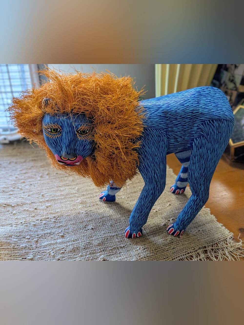 Zeny Fuentes Oaxacan alebrije sculpture featuring a vibrant orange mane READ